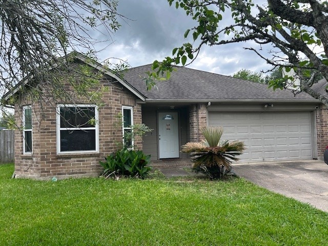 view of front of property with brick siding, a shingled roof, concrete driveway, a garage, and a front yard