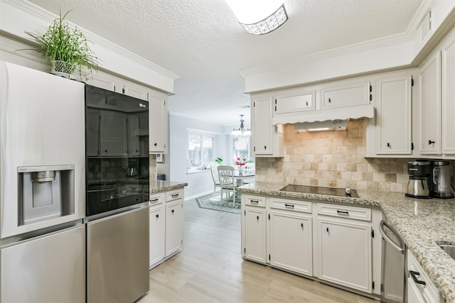 kitchen with fridge with ice dispenser, ornamental molding, light stone countertops, decorative backsplash, and black electric stovetop