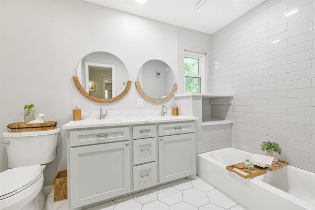 full bath with tile patterned floors, a sink, double vanity, and toilet
