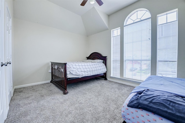 carpeted bedroom with baseboards and a ceiling fan