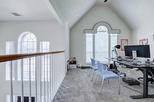 home office featuring carpet and vaulted ceiling
