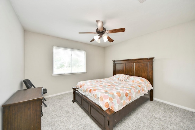 bedroom featuring light carpet, baseboards, and ceiling fan