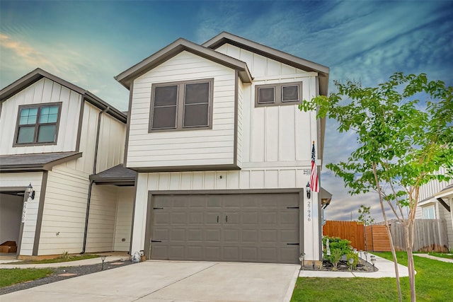 27946 Western Creek Ct, Katy, TX 77494 - multi unit property featuring an attached garage, fence, board and batten siding, and driveway
