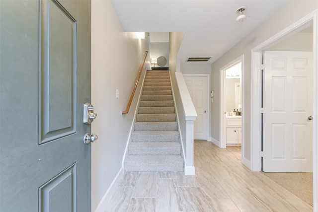 interior space with baseboards and visible vents