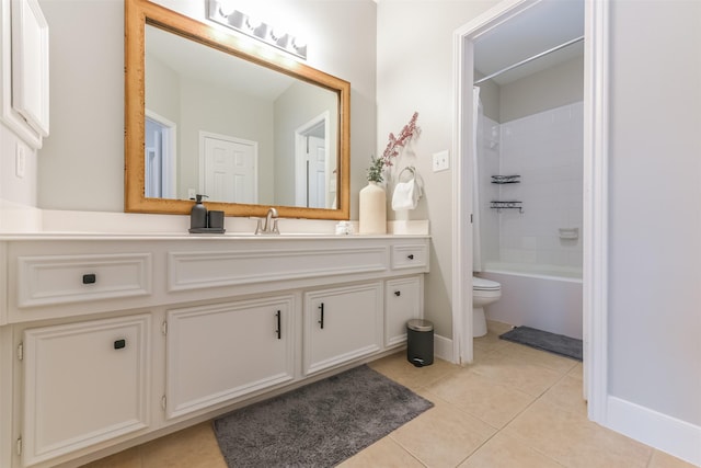 full bath featuring vanity, tile patterned flooring, toilet, and bathing tub / shower combination