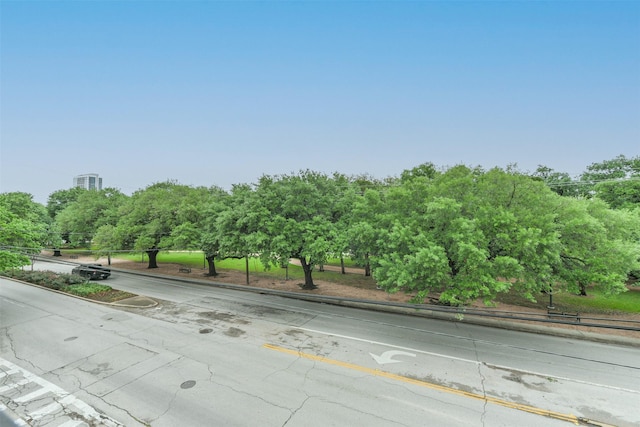 view of road with sidewalks and curbs