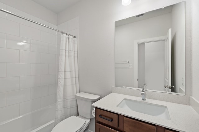 full bathroom with shower / bath combo, visible vents, vanity, and toilet