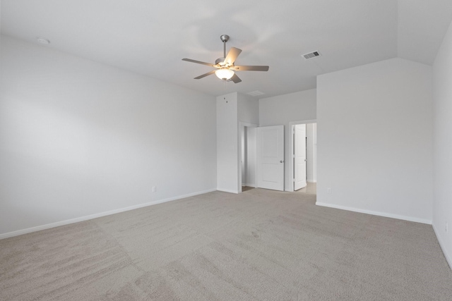 carpeted empty room with baseboards, visible vents, and ceiling fan