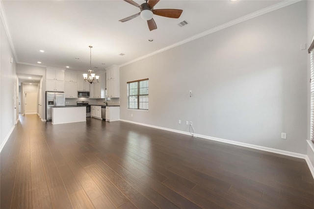 unfurnished living room with baseboards, ornamental molding, ceiling fan with notable chandelier, and visible vents