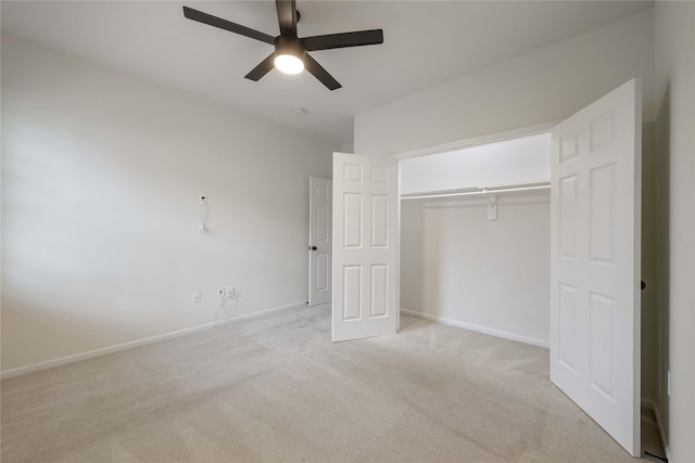 unfurnished bedroom featuring a ceiling fan, baseboards, light carpet, and a closet