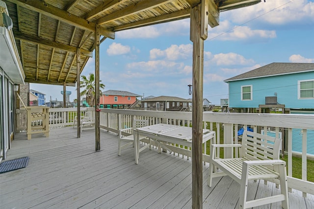 23001 Fresca St, Galveston, TX 77554 - wooden deck featuring a residential view