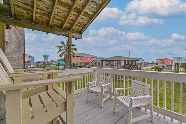 23001 Fresca St, Galveston, TX 77554 - deck featuring a residential view and a lawn