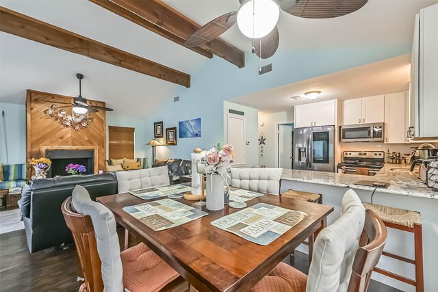 23001 Fresca St, Galveston, TX 77554 - dining space featuring ceiling fan, beamed ceiling, high vaulted ceiling, and dark wood-style flooring