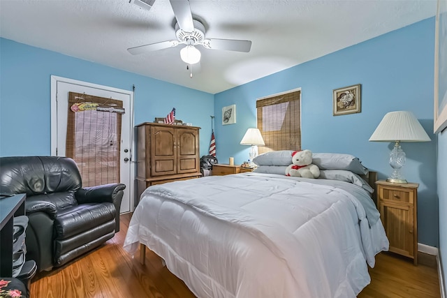 23001 Fresca St, Galveston, TX 77554 - bedroom with wood finished floors and a ceiling fan