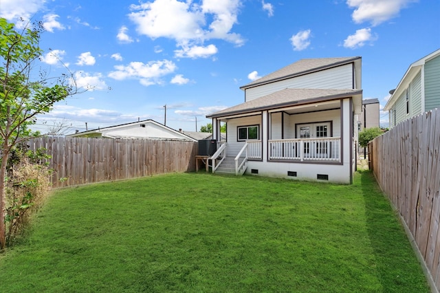 1215 E 34th St Unit A, Houston, TX 77022 - back of house with roof with shingles, a fenced backyard, crawl space, and a porch