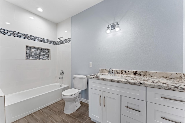 1215 E 34th St Unit A, Houston, TX 77022 - bathroom with vanity, tub / shower combination, and wood finish floors