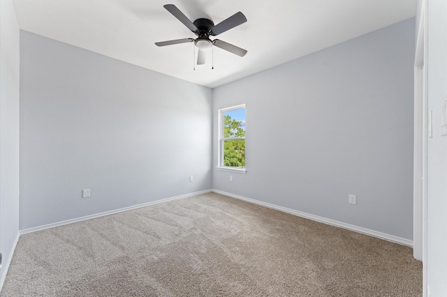 1215 E 34th St Unit A, Houston, TX 77022 - carpeted spare room featuring baseboards and a ceiling fan