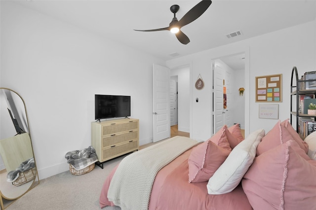 bedroom featuring carpet, visible vents, a ceiling fan, and baseboards