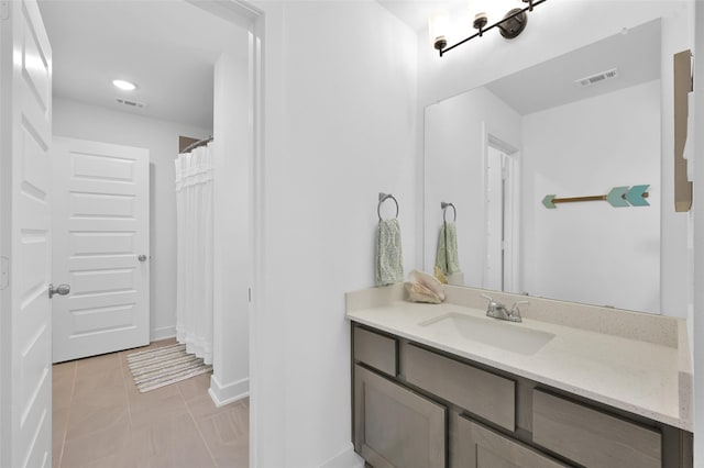 full bath with baseboards, vanity, visible vents, and recessed lighting