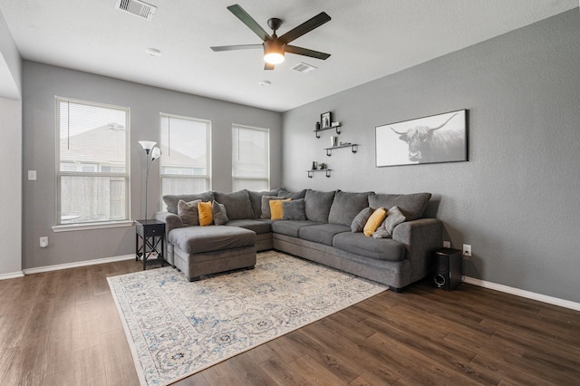 1962 Briar Grove Dr, Conroe, TX 77301 - living room with dark wood finished floors, a ceiling fan, and baseboards