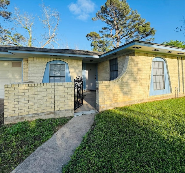 view of exterior entry with brick siding