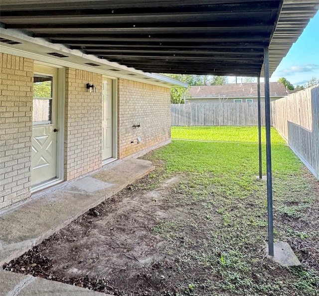view of yard with a fenced backyard