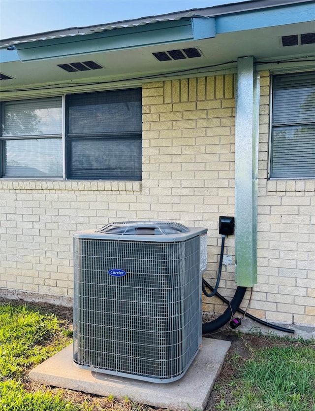 details with brick siding and cooling unit