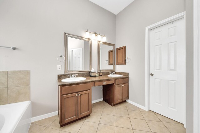 6222 Skyline Dr Unit 27, Houston, TX 77057 - bathroom featuring a bath, tile patterned flooring, and a sink