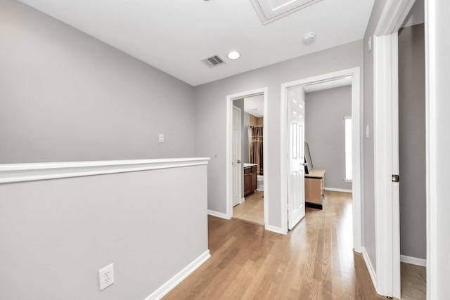 6222 Skyline Dr Unit 27, Houston, TX 77057 - hallway with light wood-type flooring, baseboards, visible vents, and recessed lighting