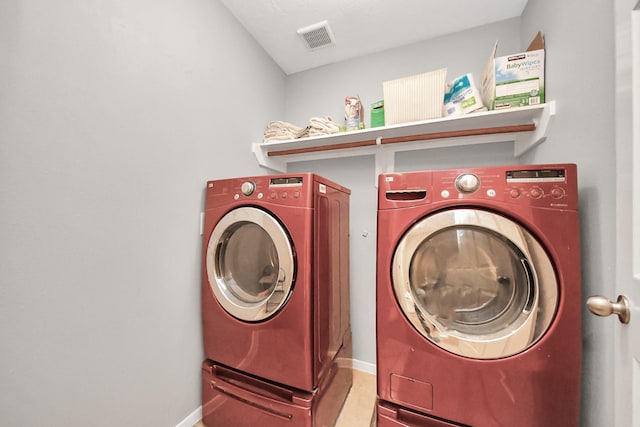 6222 Skyline Dr Unit 27, Houston, TX 77057 - laundry area featuring baseboards, visible vents, washer and dryer, and laundry area