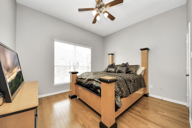 6222 Skyline Dr Unit 27, Houston, TX 77057 - bedroom with ceiling fan, baseboards, and light wood-type flooring