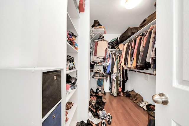 6222 Skyline Dr Unit 27, Houston, TX 77057 - walk in closet featuring wood finished floors