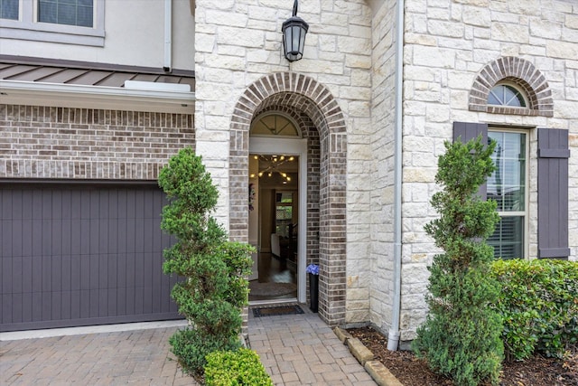 entrance to property with brick siding and stone siding