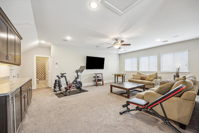 living area featuring visible vents, beverage cooler, ceiling fan, recessed lighting, and light colored carpet