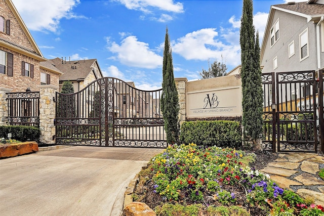 view of gate with fence
