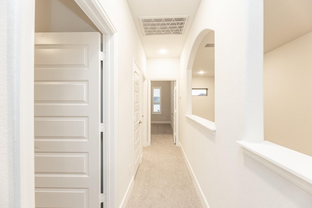4827 Highland Stream Ct, Fulshear, TX 77441 - hall featuring baseboards, arched walkways, visible vents, and carpet
