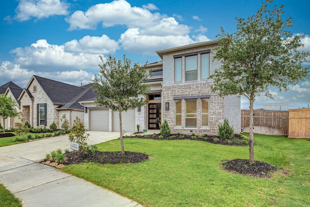 4827 Highland Stream Ct, Fulshear, TX 77441 - view of front of home featuring a front lawn, fence, stone siding, and driveway