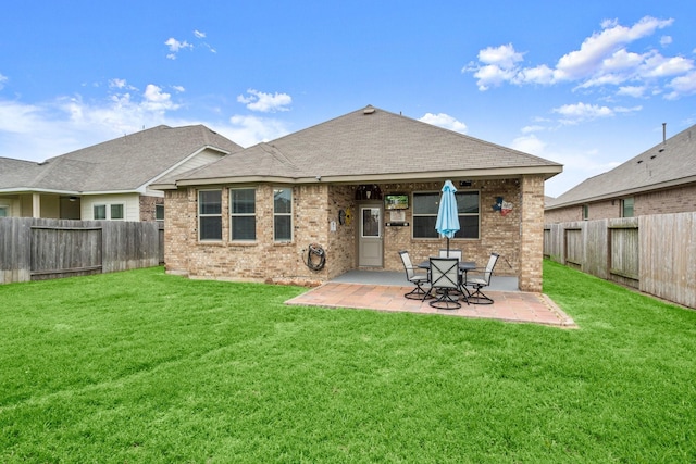 16231 Westley Ridge Dr, Hockley, TX 77447 - rear view of house featuring brick siding, a patio area, and a shingled roof