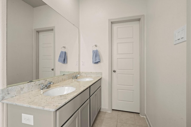 16231 Westley Ridge Dr, Hockley, TX 77447 - bathroom featuring tile patterned floors, double vanity, and baseboards