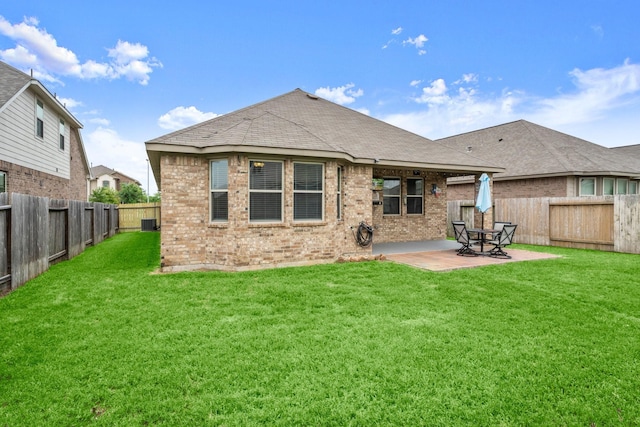 16231 Westley Ridge Dr, Hockley, TX 77447 - back of house with brick siding, a patio, a shingled roof, and central air condition unit