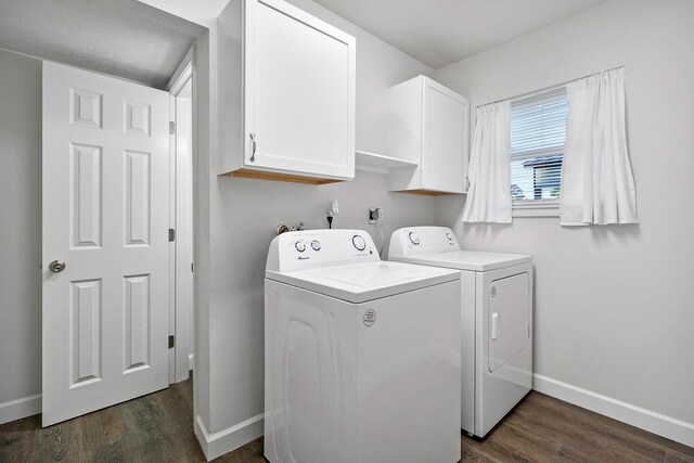washroom with cabinet space, baseboards, dark wood-style floors, and separate washer and dryer