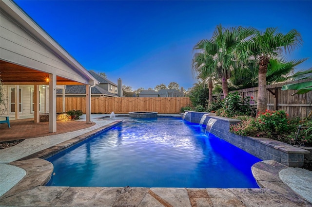 view of pool with a fenced backyard, a patio area, and a pool with connected hot tub