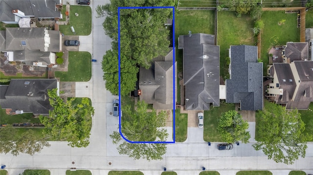 birds eye view of property with a residential view
