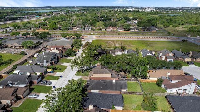 bird's eye view featuring a residential view and a water view