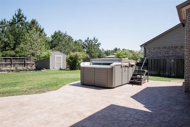 view of patio / terrace featuring fence, a storage unit, and an outbuilding