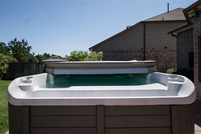 exterior space featuring a hot tub