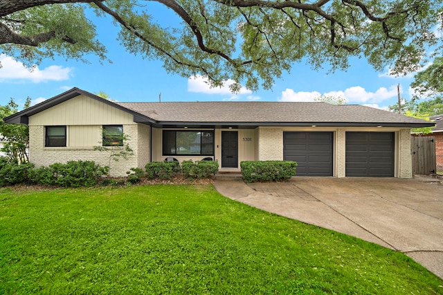 5301 Nina Lee Ln, Houston, TX 77092 - single story home with brick siding, a garage, a front yard, concrete driveway, and a shingled roof