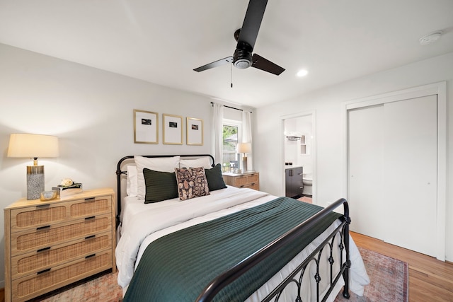 5301 Nina Lee Ln, Houston, TX 77092 - bedroom with light wood-type flooring, a closet, ensuite bathroom, recessed lighting, and a ceiling fan