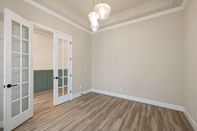 10021 Preserve Way, Conroe, TX 77385 - unfurnished room featuring french doors, wood finished floors, baseboards, and crown molding