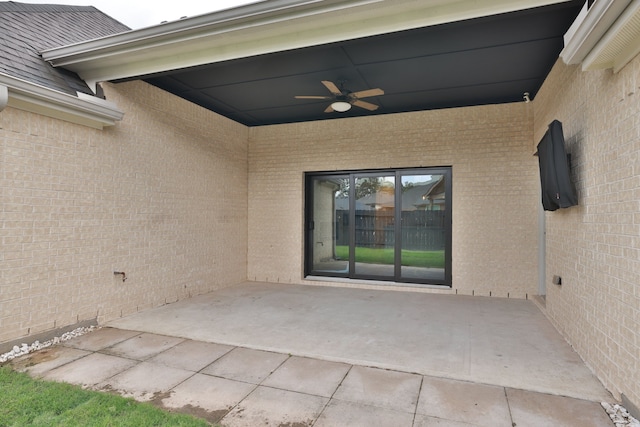 10021 Preserve Way, Conroe, TX 77385 - doorway to property featuring ceiling fan, a patio area, and brick siding